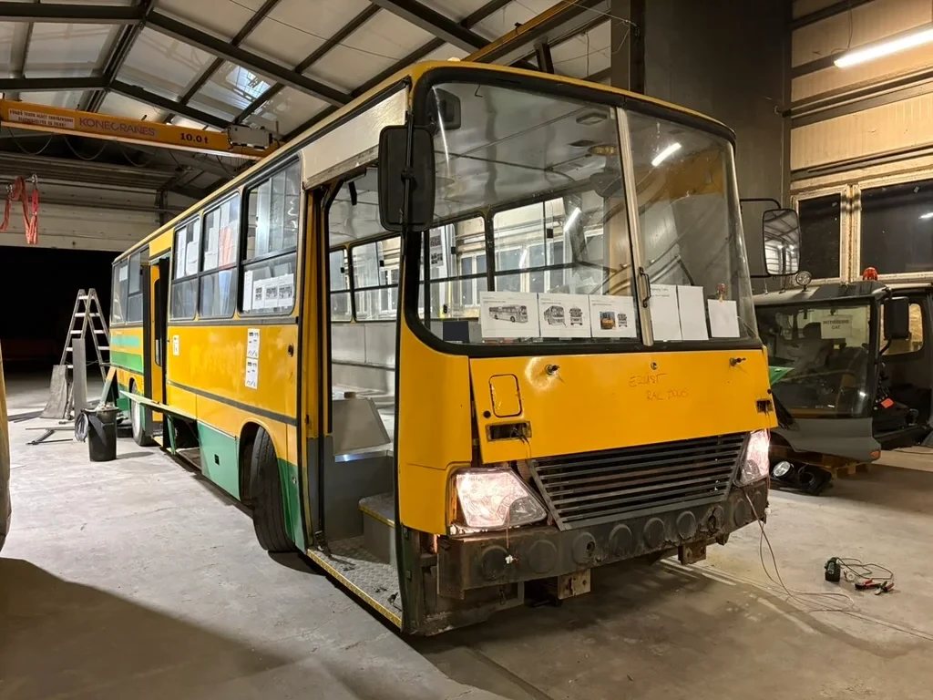 Bus front with panels removed during conversion in the workshop