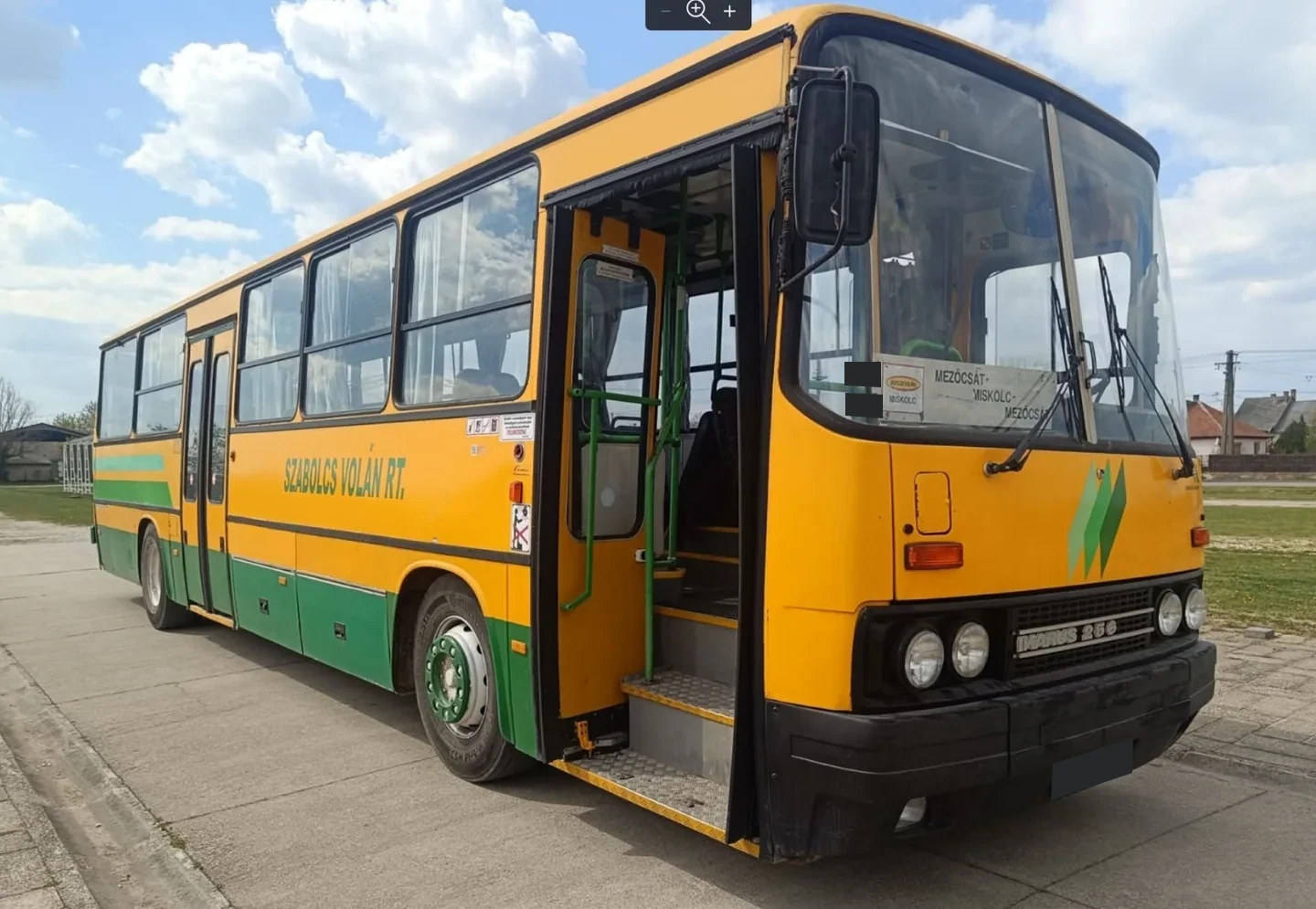 Yellow and green Ikarus bus shown in the construction archive